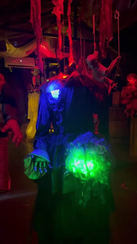 A headless ghost figure holding a glowing head in its hand while slowly turning. Видео 347955362