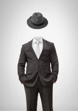 Headless man with surreal floating hat Stock Photos