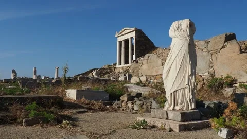 Headless Statue and the Temple of Isis, Delos Archaeological Site, UNESCO World Stock Footage 273592404
