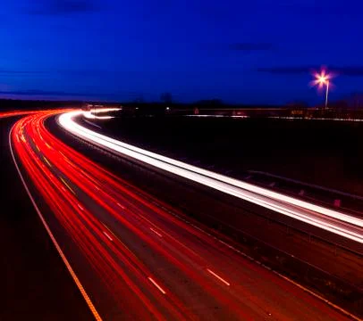 Headlight and tail light trails at night Stock Photos
