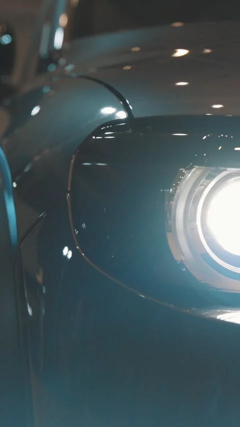 The headlight of a black car Stock Footage 328452366