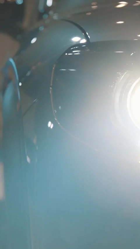 The headlight of a black electric car Stock Footage 328452397