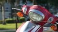 The Headlight of A Bright Red Scooter HD Footage