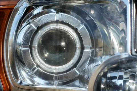 Headlight car Projector LED of a modern luxury technology and auto detail Stock Photos