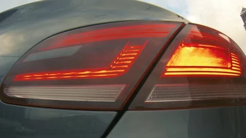 The headlight of the car with the turn signal on. Stock Footage 80506118