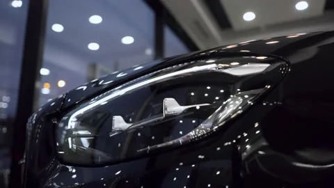 Headlight. Close up of details of headlights of anonymous prestigious white Stock Footage 180014992