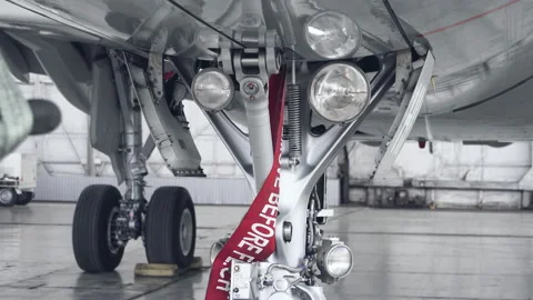 The headlight on the front of the plane lights up Stock Footage 107282826