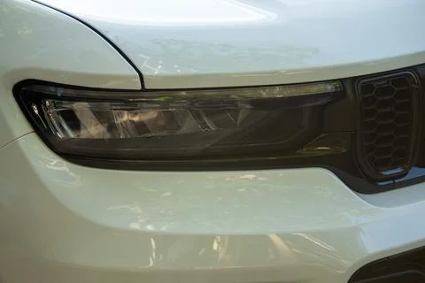 The headlight of a modern crossover SUV Stock Photos