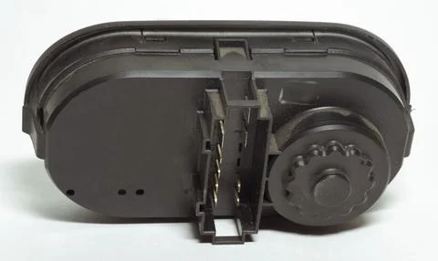 Headlight position control module back side with connection male pins Stock Photos