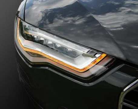 Headlight of prestigious car close up Stock Photos
