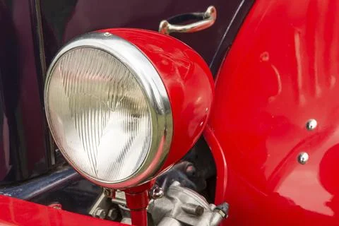 Headlight of a red old-timer Stock Photos