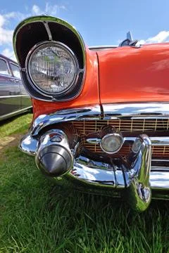 Headlight retro car on background of cloudy sky. Vintage. (Luxury, wealth, .. Stock Photos
