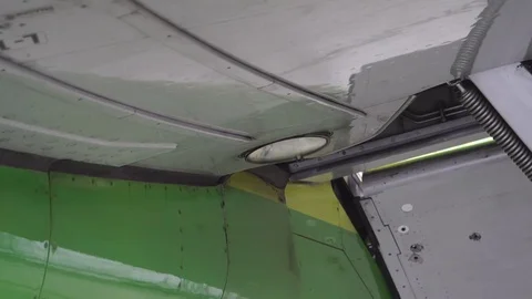 The headlight on the wing lights up airplane Stock Footage 84378676