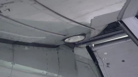 The headlight on the wing lights up airplane Stock Footage 107283306