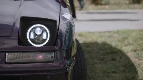 Headlight wink: pop-up mechanism performs rise fall ritual. Stock Footage 309993189