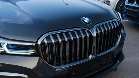 Headlights and radiator grill of the new BMW 7 Series Sedan M760Li xDrive.  Stock Footage 114288802