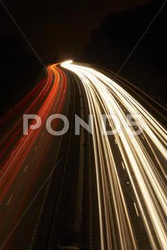 Headlights And Tail Lights On A Motorway At Night Stock Photos
