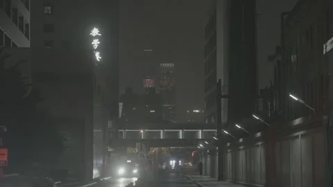 Headlights Approach Through Dark Wangfujing Alley in Beijing Stock Footage 340480724