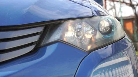 Headlights blinking while using remote key to open or close the car Stock Footage 133343445