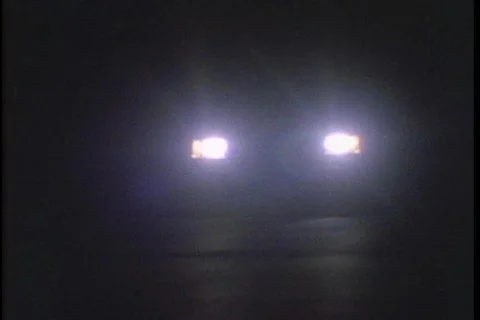 Headlights at night Stock Footage