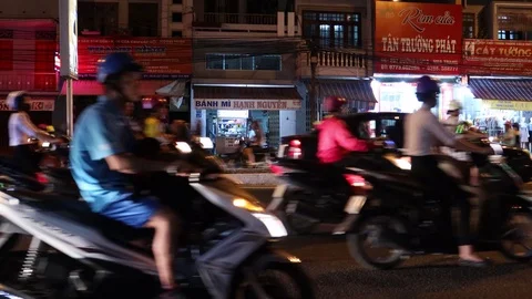 Headlights of passing motorcyclists without focus in Vietnam. Stock Footage 119562959