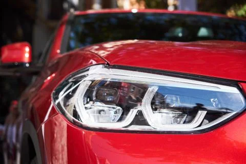 Headlights of red car Stock Photos
