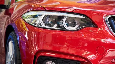 Headlights of red car Stock Photos