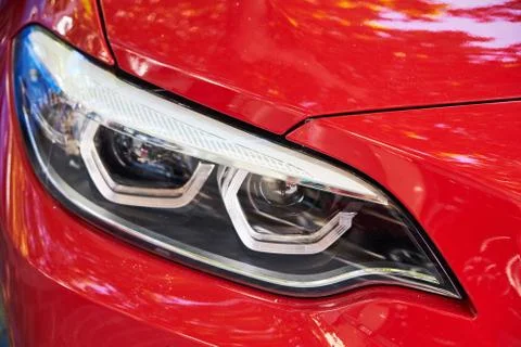 Headlights of red car Stock Photos