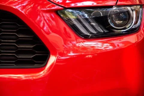 Headlights of red car Stock Photos