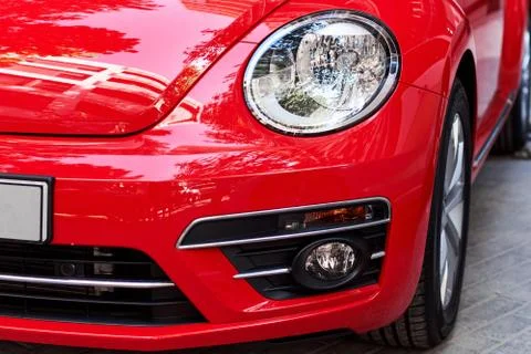 Headlights of red car Stock Photos