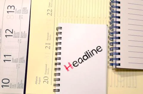 Headline text concept on notebook Stock Photos