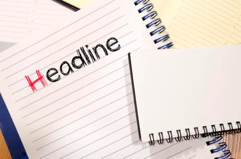 Headline text concept on notebook Stock Photos