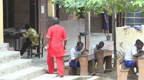 HEADMISTRESS WALKING BY OUTDOOR CLASSROOM Stock Footage 60115985