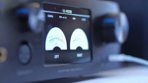 Headphone amplifier, volume control knob, measuring Decibels. Stock Footage 74362666