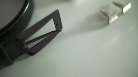 Headphone earcup with audio plug on a clean tabletop Stock Footage 336466916