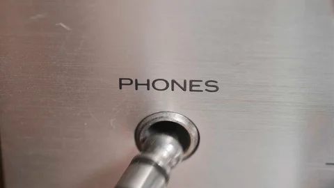 Headphone jack being plugged in Stock Footage 116310346