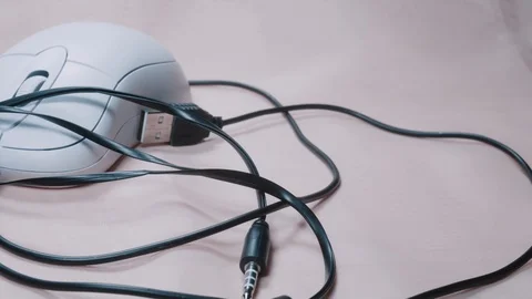 Headphones and computer mouse close-up 4K Stock Footage 100707546