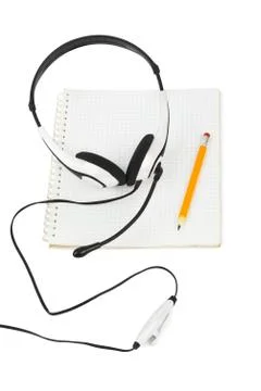 Headphones and notepad Stock Photos