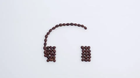 Headphones and notes made from roasted coffee beans Stockbeeldmateriaal 173604883