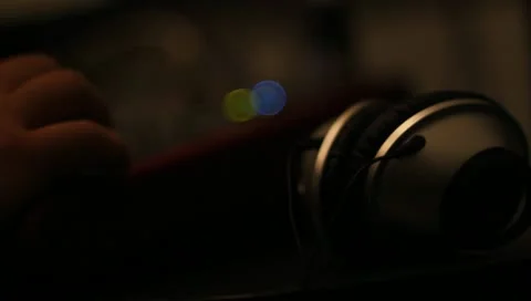 Headphones being picked up off of table Stock Footage 10710965
