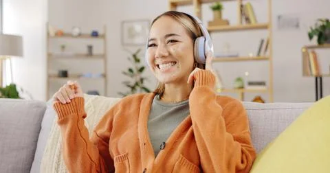 Headphones, home and happy woman listening to music for mental health, youth Stock Photos