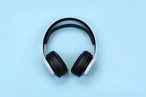 Headphones for playing a computer console on a blue background, layout Stock Photos