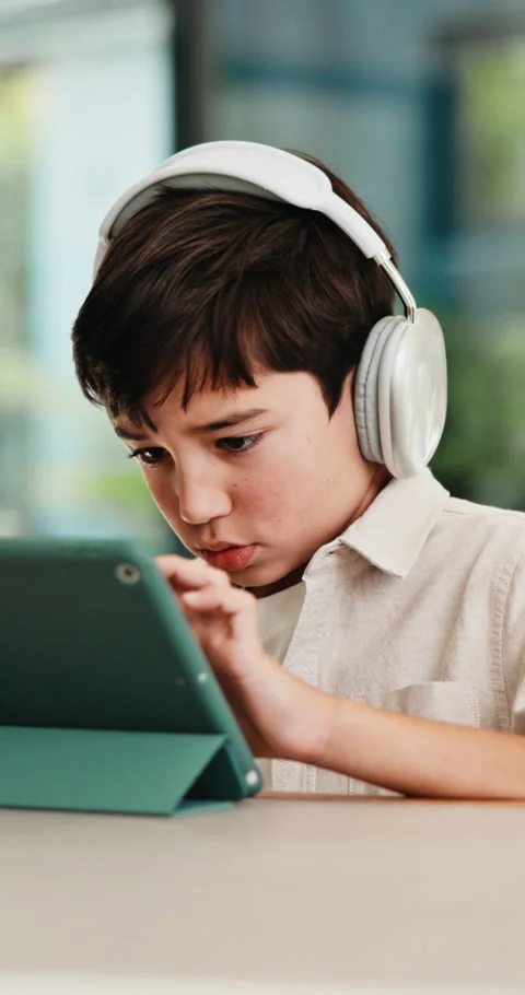 Headphones, tablet and child for e learning, online education and listening to Stock Footage 335877017