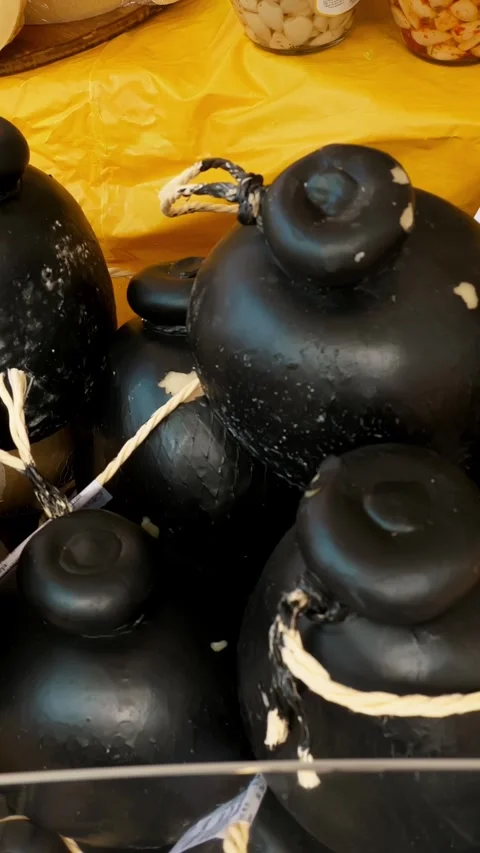 Heads of cheese. different types of homemade hard cheeses. street food. retail Stock Footage 317846707