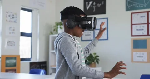 Headset activating, student reaching, sweeping, pivoting and pinching near Stock Footage 341241129