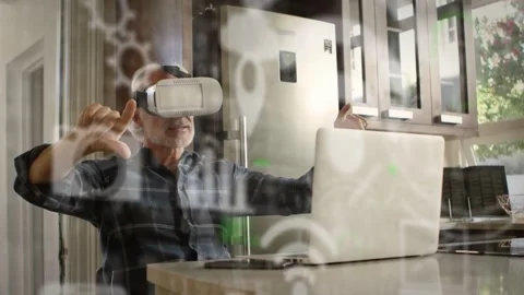 On headset activation senior man in VR pointing, pinching, rotating gear UI to Stockbeeldmateriaal 333477744