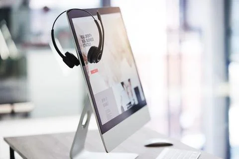 Headset, call center and computer screen in office for consulting, crm and Stock Photos