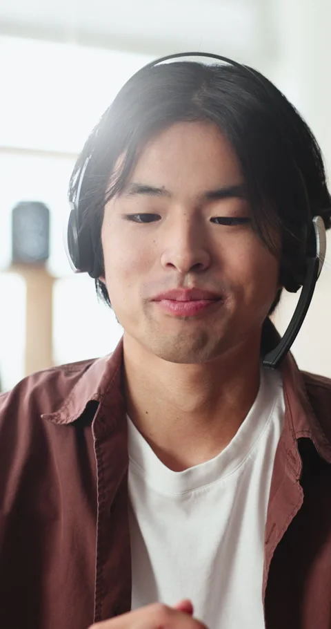 Headset, customer service and man in home with remote work for crm, helpdesk or Stock Footage 331635752
