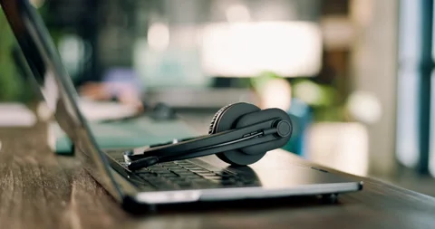 Headset, empty and laptop in call center office for customer support, online Stock Footage 343114990