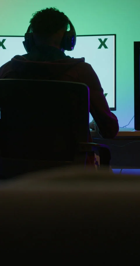 Headset, gamer or man with computer screen in home, virtual competition or Stock Footage 335105090